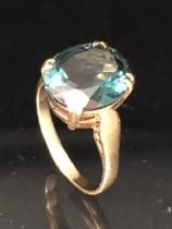 9ct Gold ring set with a synthetic translucent Green gemstone in a four claw setting, size approx '