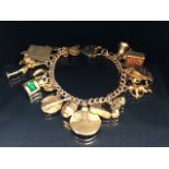 9ct Gold Charm Bracelet with approx seventeen charms to include Cupid, a British Passport, Archer,