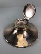 Silver hallmarked large circular based ink well with hinged lid and glass inset, the filled base