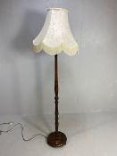 Antique style wooden turned standard lamp base with shade approximately 190cm overall