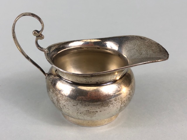 Silver hallmarked creamer on pedestal base with rounded body and scroll handle maker T.W approx 48g - Image 3 of 5
