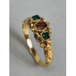 Antique unmarked gold ring of Victorian style design set with gemstones mounted in scroll work