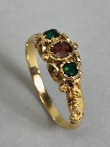 Antique unmarked gold ring of Victorian style design set with gemstones mounted in scroll work