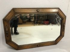 Antique Mirror, early 20th century elongated octagonal bevel edged wall mirror set in an oak frame