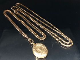 9ct Gold very long (approx 140cm) chain with a gold coloured Locket (total weight approx 27g)