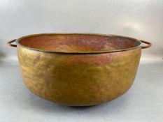 Copper Pan, large deep hand planished copper pan with twin brass handles approximately 44cm across