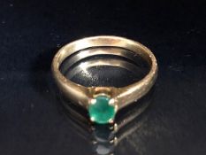 18ct yellow Gold ring set with a single faceted Emerald in a four claw setting. The Emerald approx