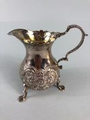 Victorian Silver Hallmarked and repousse cream jug on splayed legs hallmarked for London by maker