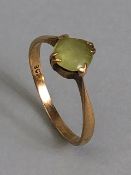9ct marked yellow gold ring set with a pale green stone approximately 1.59g size O 1/2