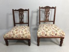 Antique furniture, two 19th century nursing chairs, carved central splat backs with sprung