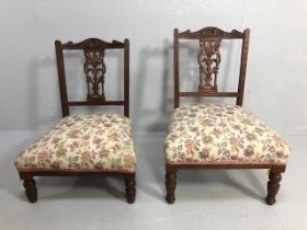 Antique furniture, two 19th century nursing chairs, carved central splat backs with sprung