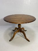 Mid century Ercol round dining table of dark wood, on capstan base with 4 legs approximately 46cm