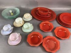 Retro Glass ware, a group of vintage red Pyrex plates and dishes, rainbow glass cups and saucers and