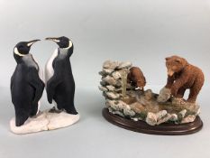 Country artists figure of mother and baby bear by a waterfall, and nature craft figurine of