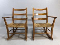 Mid Century furniture, 2 Carl Hanson style pine rocking chairs with woven coir seats 3 slat backs