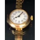 Rolex watch, early 20th century ladies 15ct gold Rolex watch, round white ceramic face with Arabic