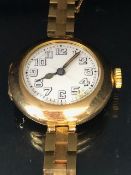Rolex watch, early 20th century ladies 15ct gold Rolex watch, round white ceramic face with Arabic