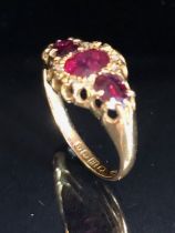 18ct Gold ring set with diamonds and red/ pink gemstones size 'O' and 3g