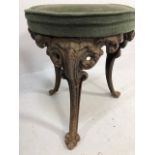 Antique Victorian style cast iron dressing table stool, round padded upholstered top on four