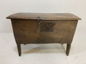 17th Century small oak coffer with metal fittings, on raised legs, approx 66cm x 34cm x 47cm