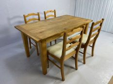 Solid oak three plank dining table with bread board ends, on tapering legs, with extension which