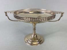 Silver sweet meat dish or Tazza with twin handles and pierced edges on a stepped pedestal base