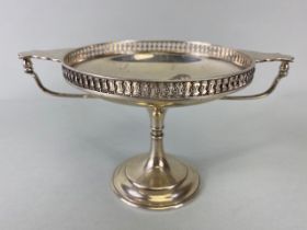 Silver sweet meat dish or Tazza with twin handles and pierced edges on a stepped pedestal base