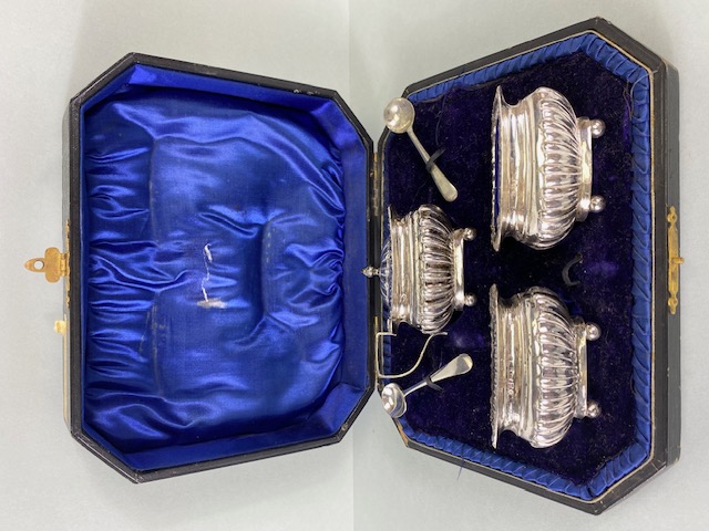 Silver Hallmarked Salts with Blue glass liners and a lidded mustard pot in presentation bod with