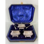 Silver Hallmarked Salts with Blue glass liners and a lidded mustard pot in presentation bod with