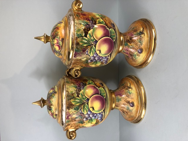 Decorators interest, a Pair of Large Baroness China lidded Urns decorated with paintings of fruit