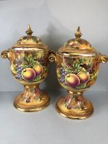 Decorators interest, a Pair of Large Baroness China lidded Urns decorated with paintings of fruit