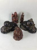 Oriental wooden carvings, to include Two Immortals a seated old man and a pair of children decorated