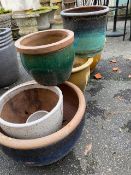 Collection of glazed ceramic garden pots, eight in total