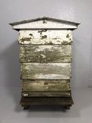 Beehive, vintage full size wooden bee hive consisting of 4 layers with stand and roof, distressed