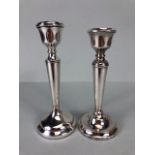A near pair of circular stepped base Silver hallmarked candlesticks by maker A T Cannon Ltd approx