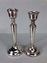 A near pair of circular stepped base Silver hallmarked candlesticks by maker A T Cannon Ltd approx