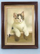 Paintings, framed oil on canvas painting in the Victorian style of a young cat looking over a