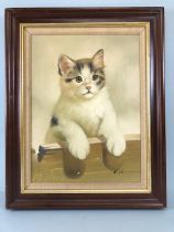 Paintings, framed oil on canvas painting in the Victorian style of a young cat looking over a