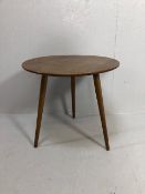 Mid century furniture, small round coffee or occasional table on tapered legs approximately 56 x
