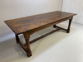 Large three plank oak refectory table with central cross stretcher and turned legs on square feet,