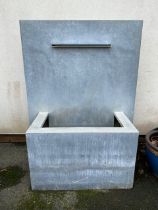 Contemporary aluminium garden water fountain with electric pump, creating a cascading water feature,