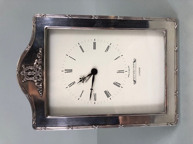 Quartz Clock with cream dial Marked for Harrods of London and mounted in a silver hallmarked frame