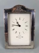 Quartz Clock with cream dial Marked for Harrods of London and mounted in a silver hallmarked frame