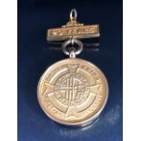 9ct Gold Medallion for First-Aid Efficiency with Bar in gold coloured mount total weight approx 9.