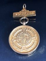 9ct Gold Medallion for First-Aid Efficiency with Bar in gold coloured mount total weight approx 9.