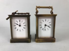 Antique clocks, two late 19th early 20th century Brass carriage clocks both with white faces and