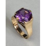 9ct Gold ring set with a Purple coloured faceted stone approx size 'M' & 3.5g