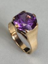 9ct Gold ring set with a Purple coloured faceted stone approx size 'M' & 3.5g