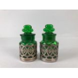 Perfume bottles, pair of early 20th century green glass bottles with shamrock stoppers, in silver