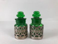 Perfume bottles, pair of early 20th century green glass bottles with shamrock stoppers, in silver